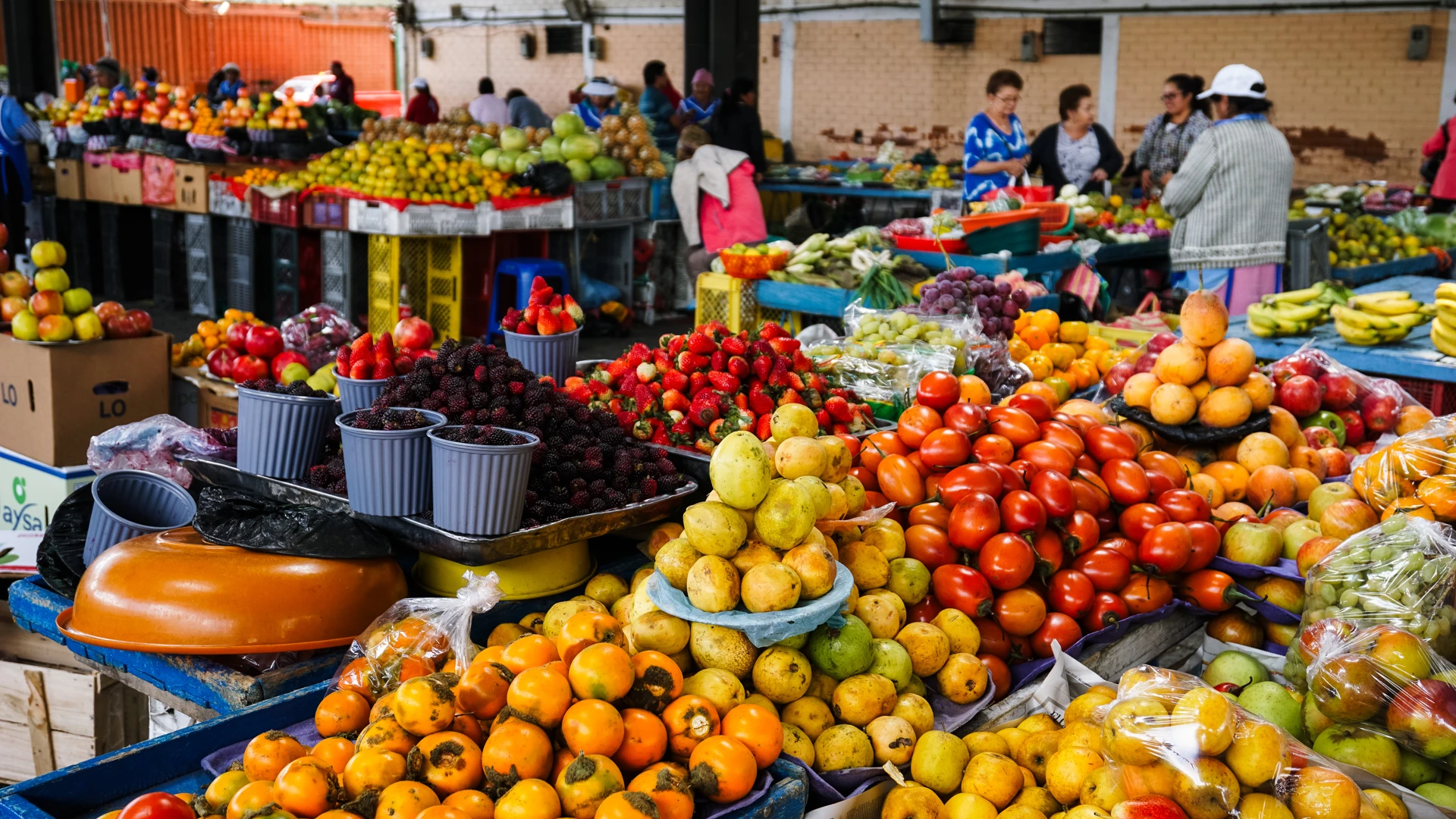 Stalls of fresh fruit and produce in a Quito market