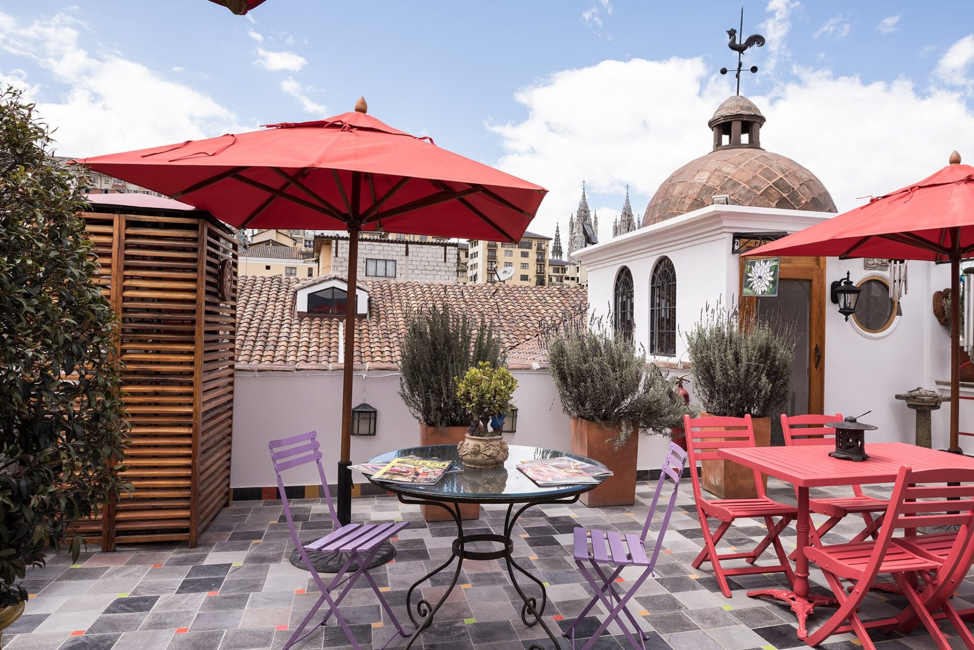 View of tables and chairs on rooftop terrace